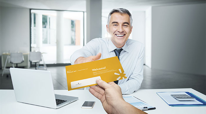 man-handing-card-to-client